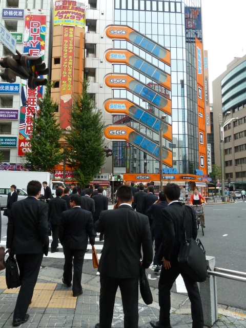 Akihabara in Tokyo, the streets are full of Japanese men in dark suits