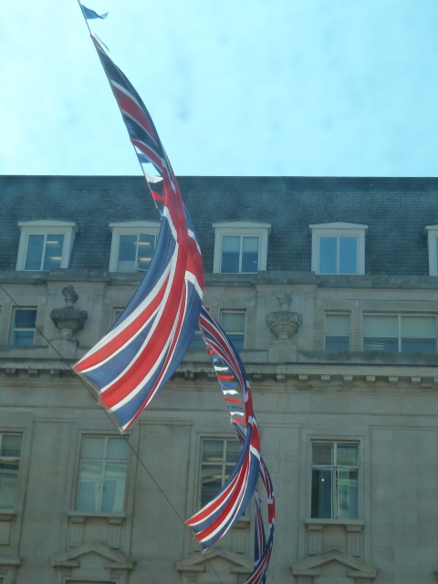 Closer views can be seen from the upper floors of Regent St buildings of patriotic flags for the Royal Wedding April 29th 2011
