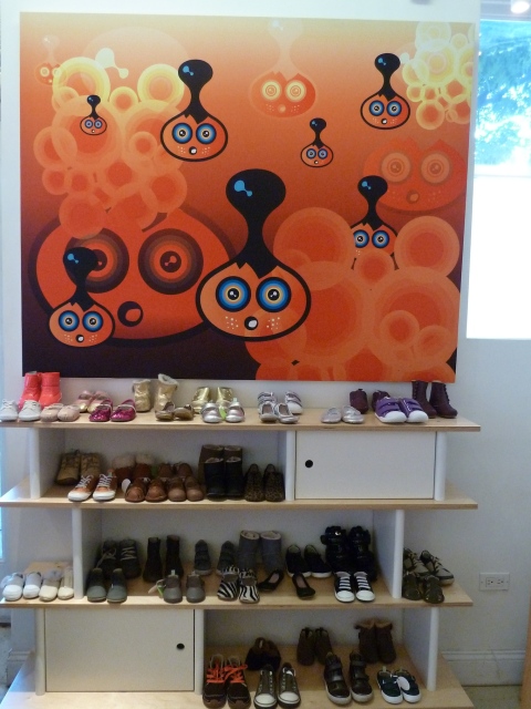 Cute artwork and baby and toddler shoes at Yoya in Manhattan